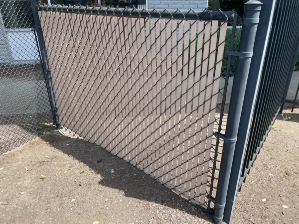 Arrowlock fence slat on a chain link fence